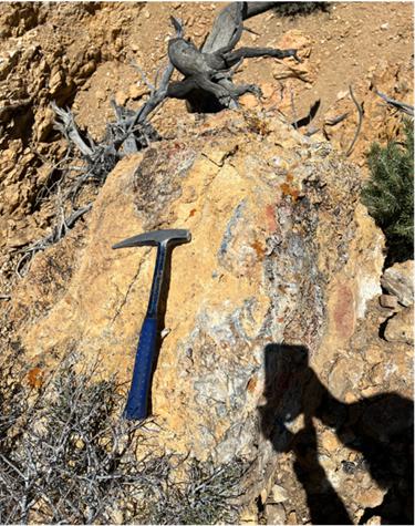 A hammer on a rock

Description automatically generated