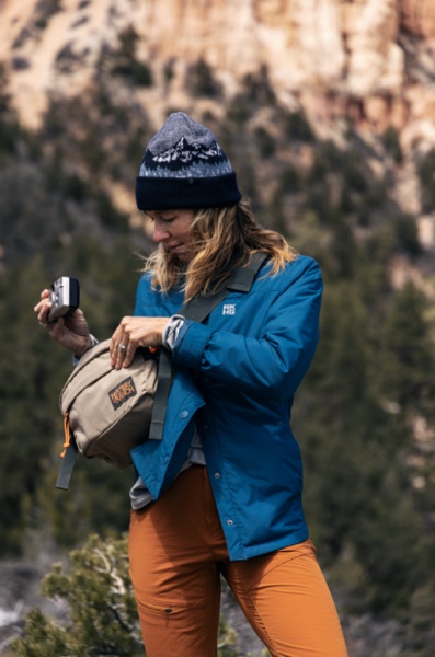 A person looking at a camera

Description automatically generated